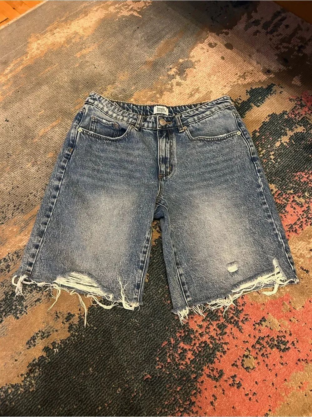 Women's Blue Denim Bermuda Shorts with Distressed Hem